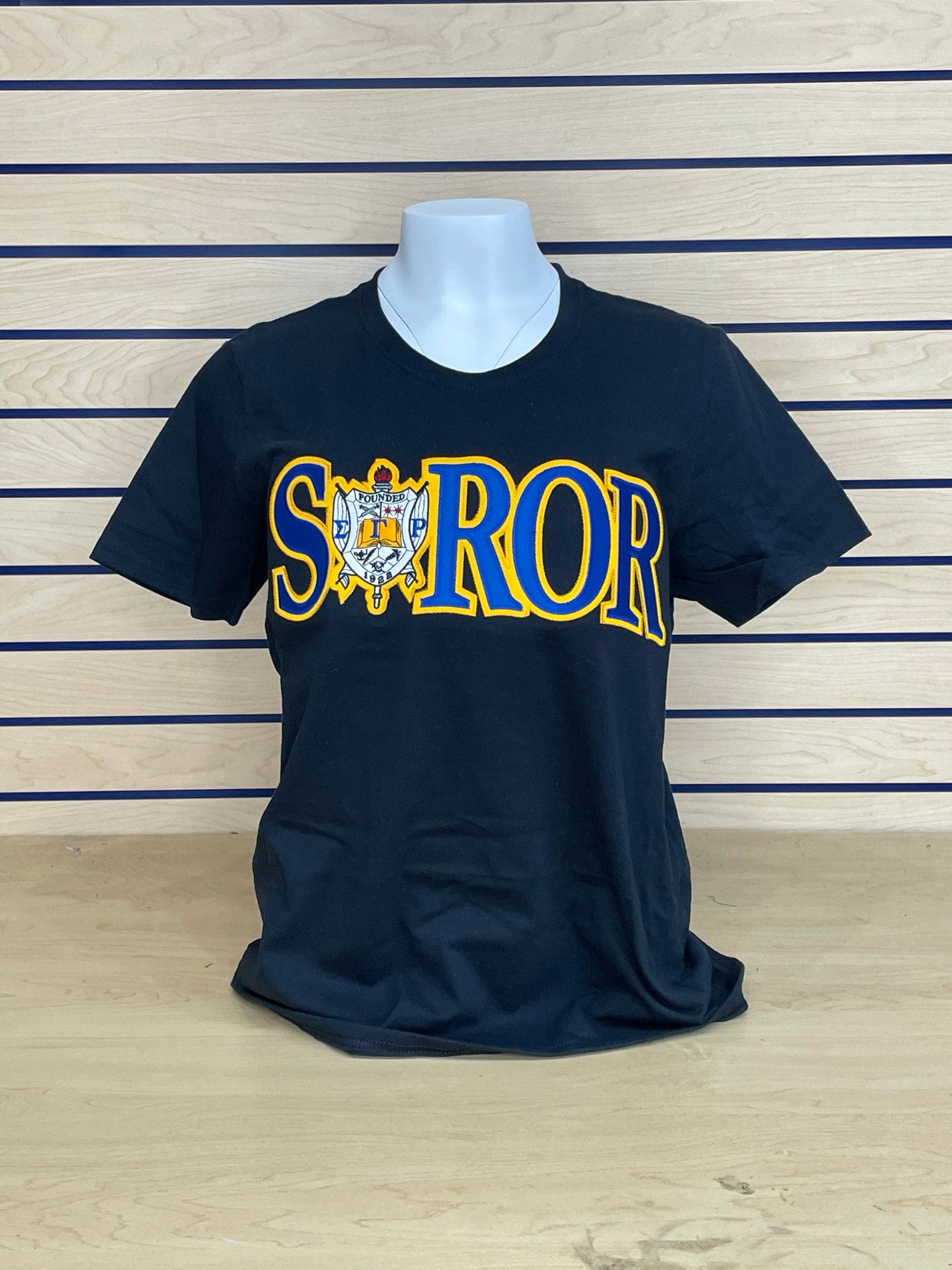 Royal blue shirt store with gold print